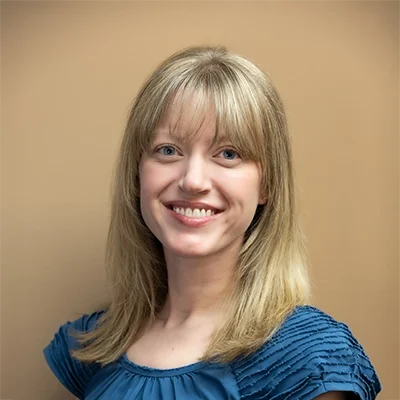 Chiropractic Oakdale MN Meghan Meghan smiling in a blue shirt.