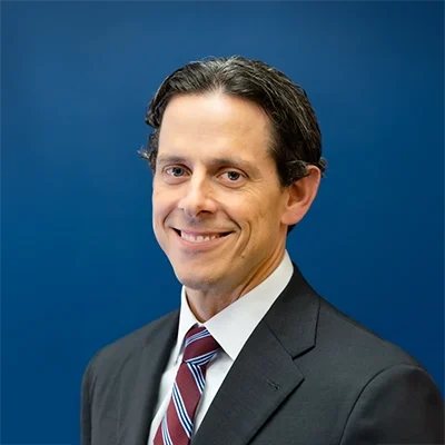 Chiropractor Oakdale MN Ben Smetana New Ben Smetana smiling while wearing a suit.